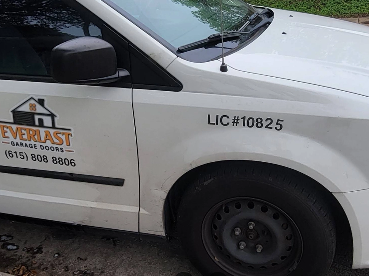 Technician providing residential garage door repair in Franklin, TN.