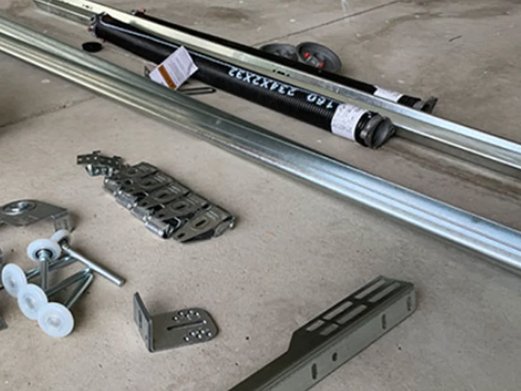 Garage technician replacing worn-out garage door parts for a Franklin homeowner