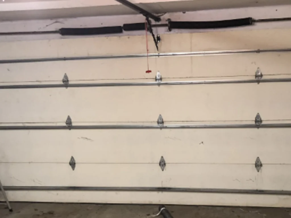 Franklin homeowner using a checklist for residential garage door repair by Everlast Garage Doors