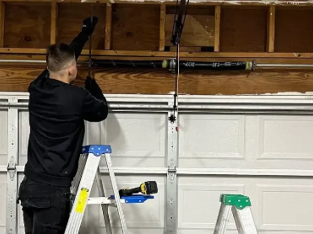 Everlast Garage Doors technician installing a new garage door in Franklin, TN, helping homeowners upgrade for safety and curb appeal