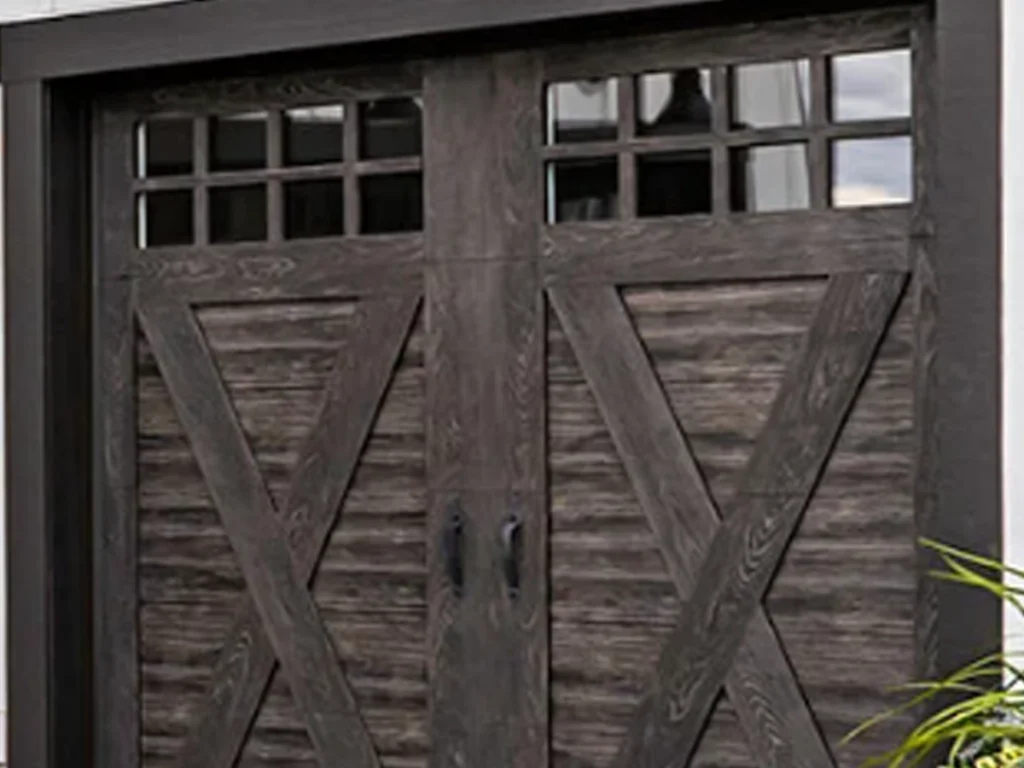 Franklin homeowner inspecting garage door for safety and functionality with Everlast Garage Doors