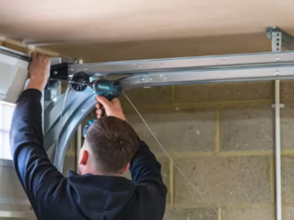 residential garage door repair Franklin TN technician checking rollers and sensors