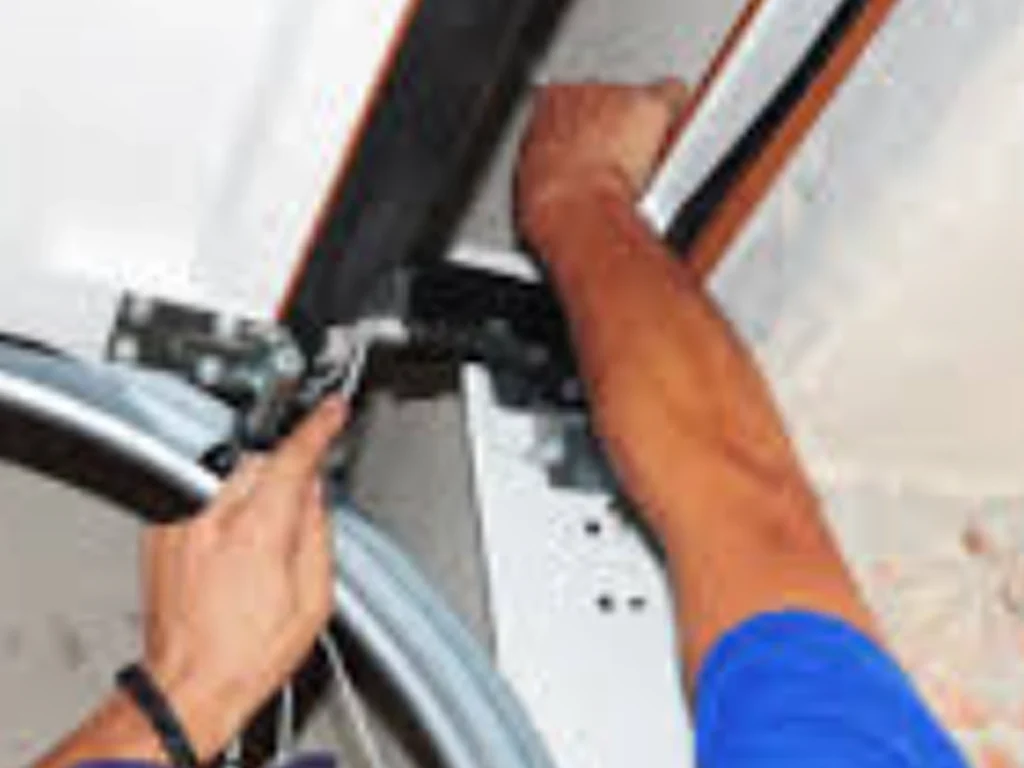 Emergency Garage Door Services technician inspecting a stuck garage door in Franklin TN