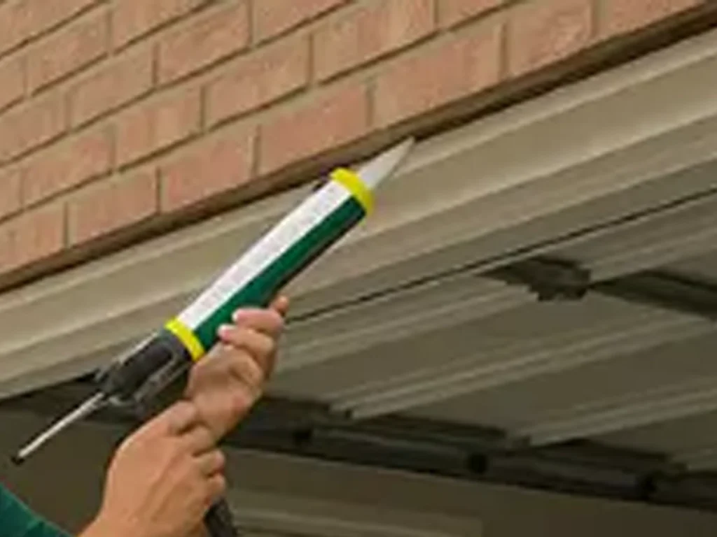 Residential garage door repair in Franklin TN by Everlast Garage Doors on a modern family home