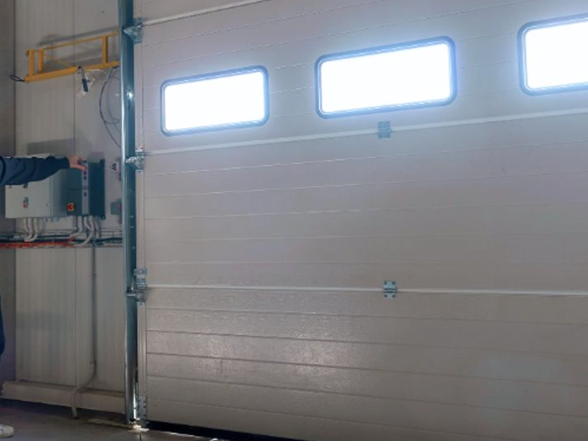commercial garage service Franklin expert inspecting a business overhead door