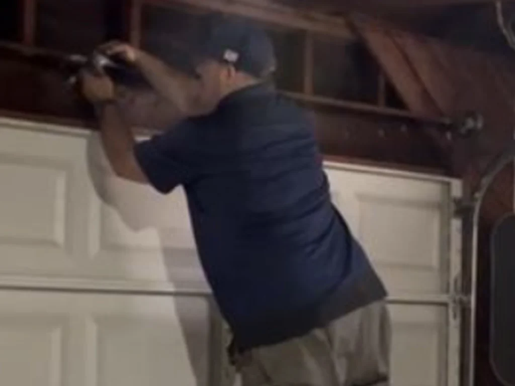 Elite Emergency Garage Door Repairs in Franklin by Everlast technicians fixing damaged door quickly