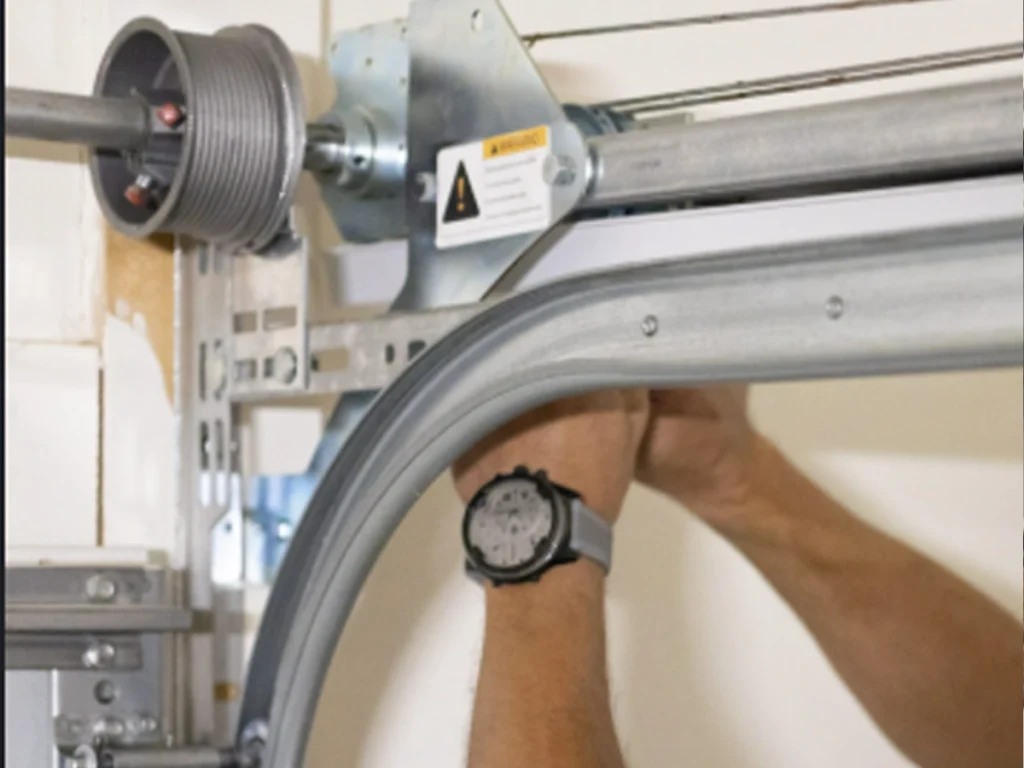 Garage Maintenance from Everlast Garage Doors with a trained technician checking rollers, springs, tracks, sensors, and opener controls