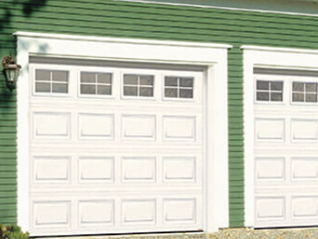 Unique Custom Garage Door Styles Franklin on a beautiful home with modern panels, windows, and clean curb appeal