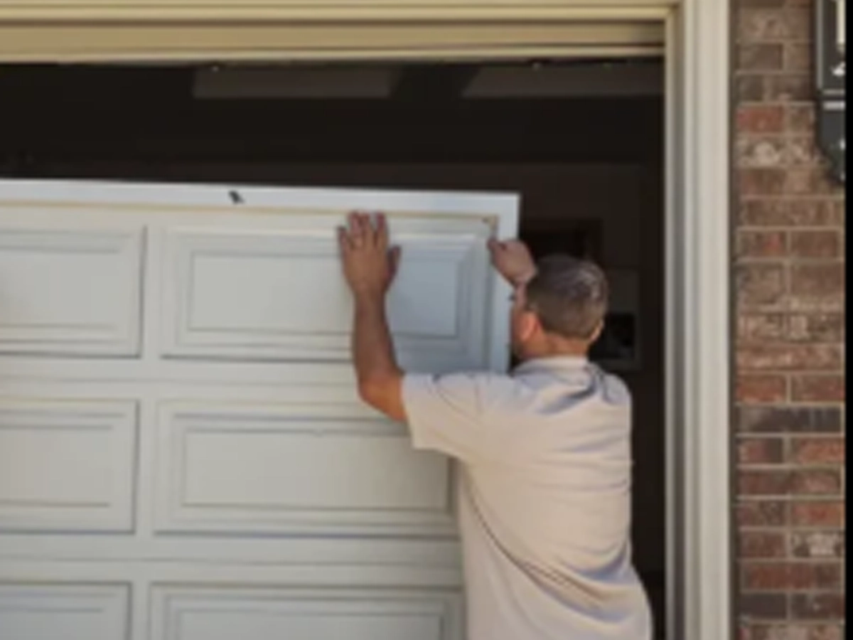 Garage Door Installation in Franklin technician setting a new residential garage door