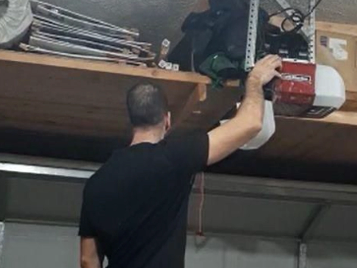 Featured Image Alt Text: Garage Door Maintenance Franklin TN technician inspecting a residential garage door