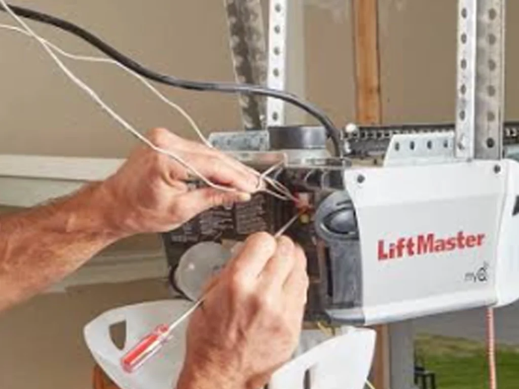 Garage Door Openers Franklin TN technician setting up a Wi-Fi garage door opener