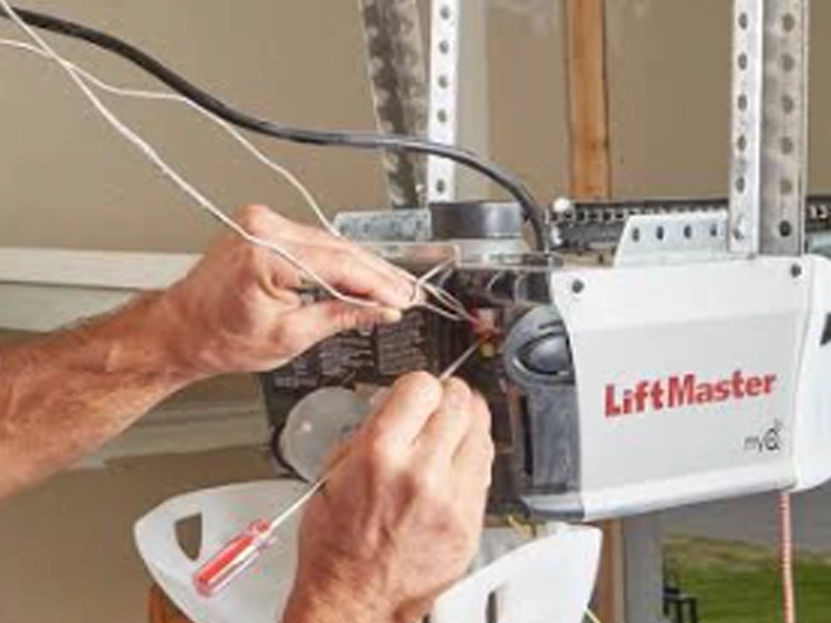 Garage Door Openers Franklin TN technician setting up a Wi-Fi garage door opener