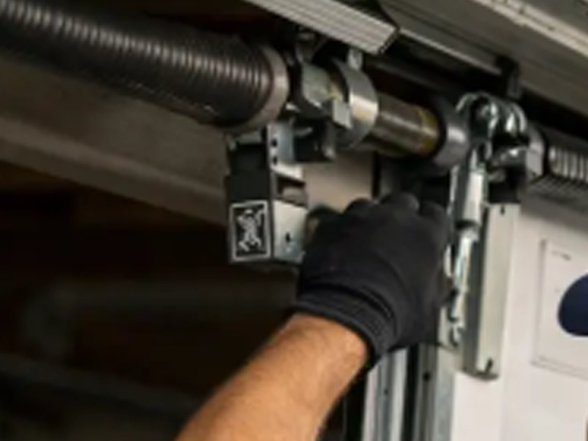 Garage Door Openers in Franklin with worn rollers hinges springs and garage door parts