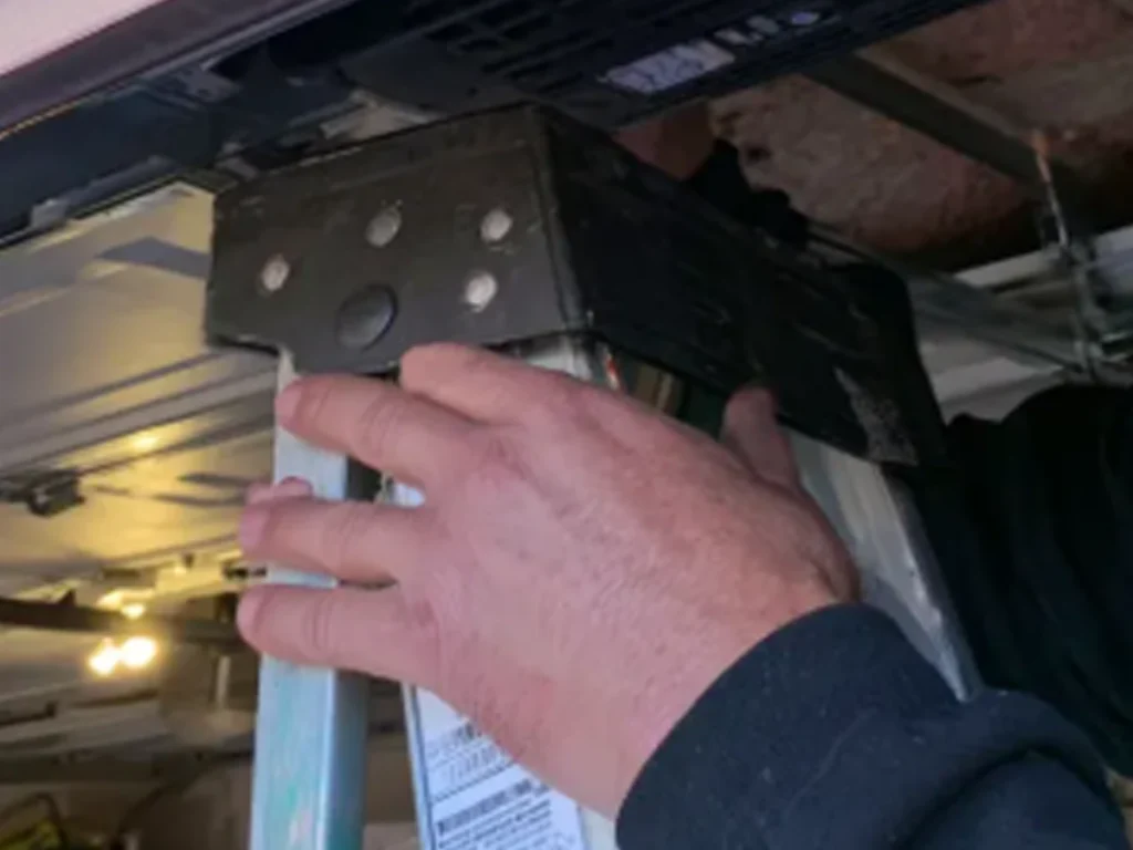 Garage door stuck open at a Franklin home while a technician performs a safe garage door repair inspection
