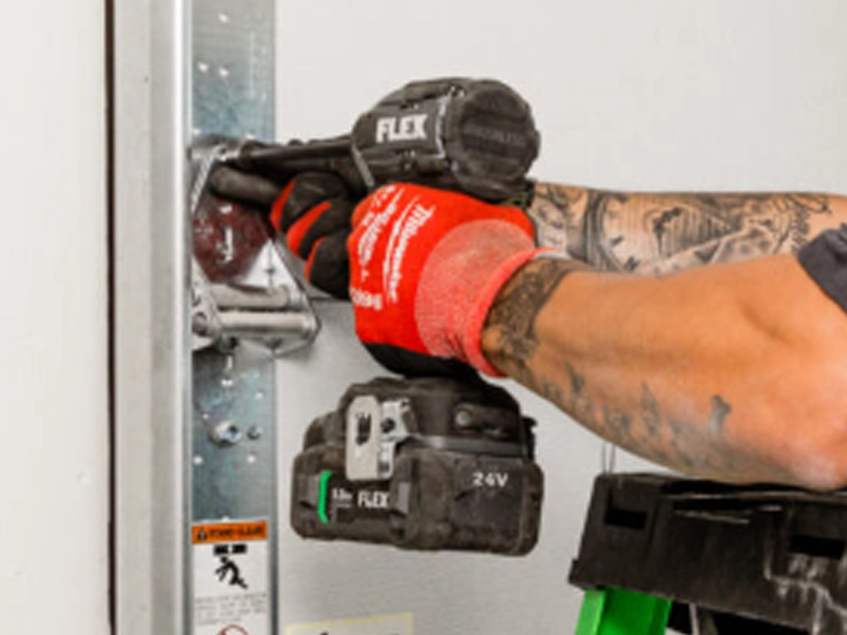 Reliable garage door replacement by certified technicians installing a new residential garage door in Franklin TN